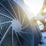 A,Technician,Is,Performing,Maintenance,On,An,Air,Conditioning,Unit