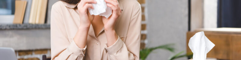 Young,Businesswoman,Suffering,From,Allergy,At,Workplace