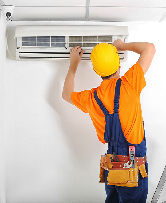 man fixing ac